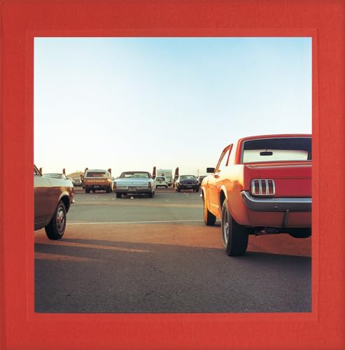 Red-framed photograph of cars on a highway, low angle view.