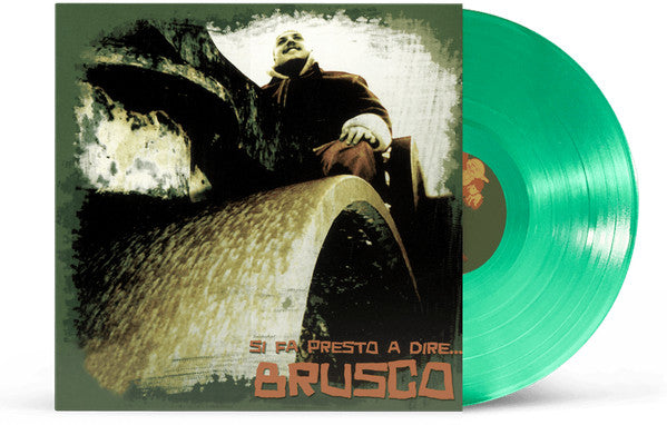 Green vinyl record with album cover featuring a man in a brown coat.