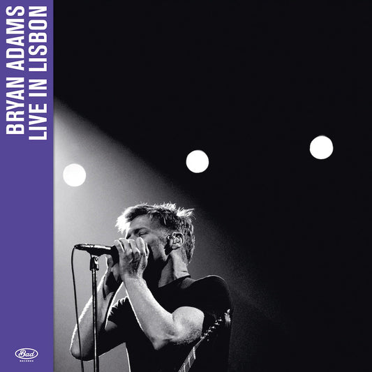 Bryan Adams live album cover: black and white photo, purple text.