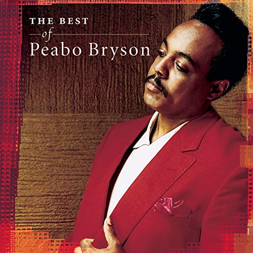 Peabo Bryson album cover, portrait of a man in a red suit.