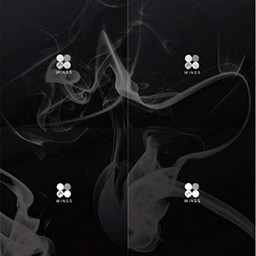 Black background with swirling white smoke and repeating "Wings" text.