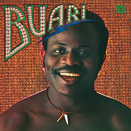 Album cover featuring a smiling man with a mustache and beaded text.