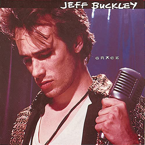Jeff Buckley looking down while holding a microphone on the Grace album cover.
