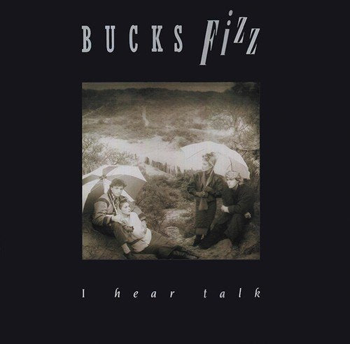 "Album cover art: 'Bucks Fizz - I Hear Talk' with monochrome image of people under umbrellas."