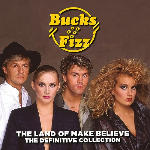 Four members of the band Bucks Fizz posed against a brown background.