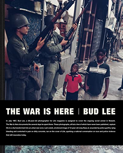 1967 photograph of armed soldiers facing Newark residents during civil unrest.