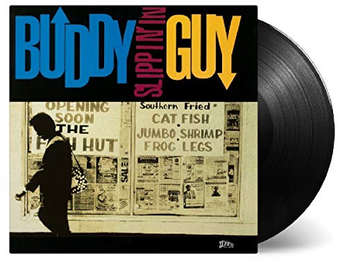 Buddy Guy’s “Slippin’ In” vinyl record with a black cover and silhouette.