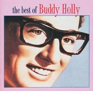 Close-up portrait of Buddy Holly wearing thick black glasses with pink background text.