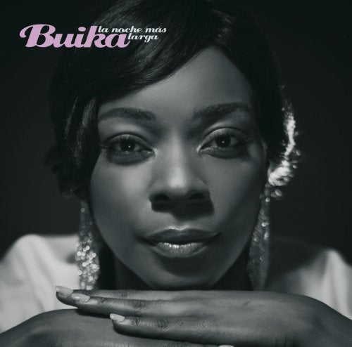 Black and white portrait of singer Buika, with sparkling earrings.