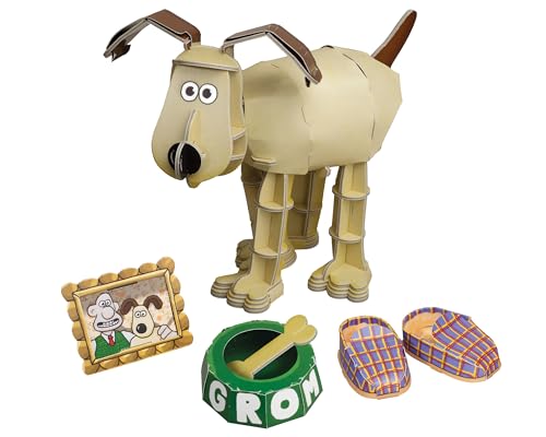 Cardboard Gromit model with picture, bowl, and slippers nearby.