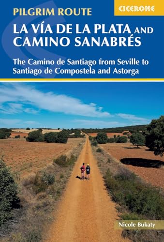 Book cover showing two hikers on a dirt path through a rural landscape.