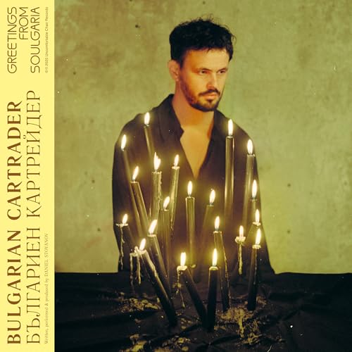 Vinyl album cover featuring a man surrounded by lit candles.