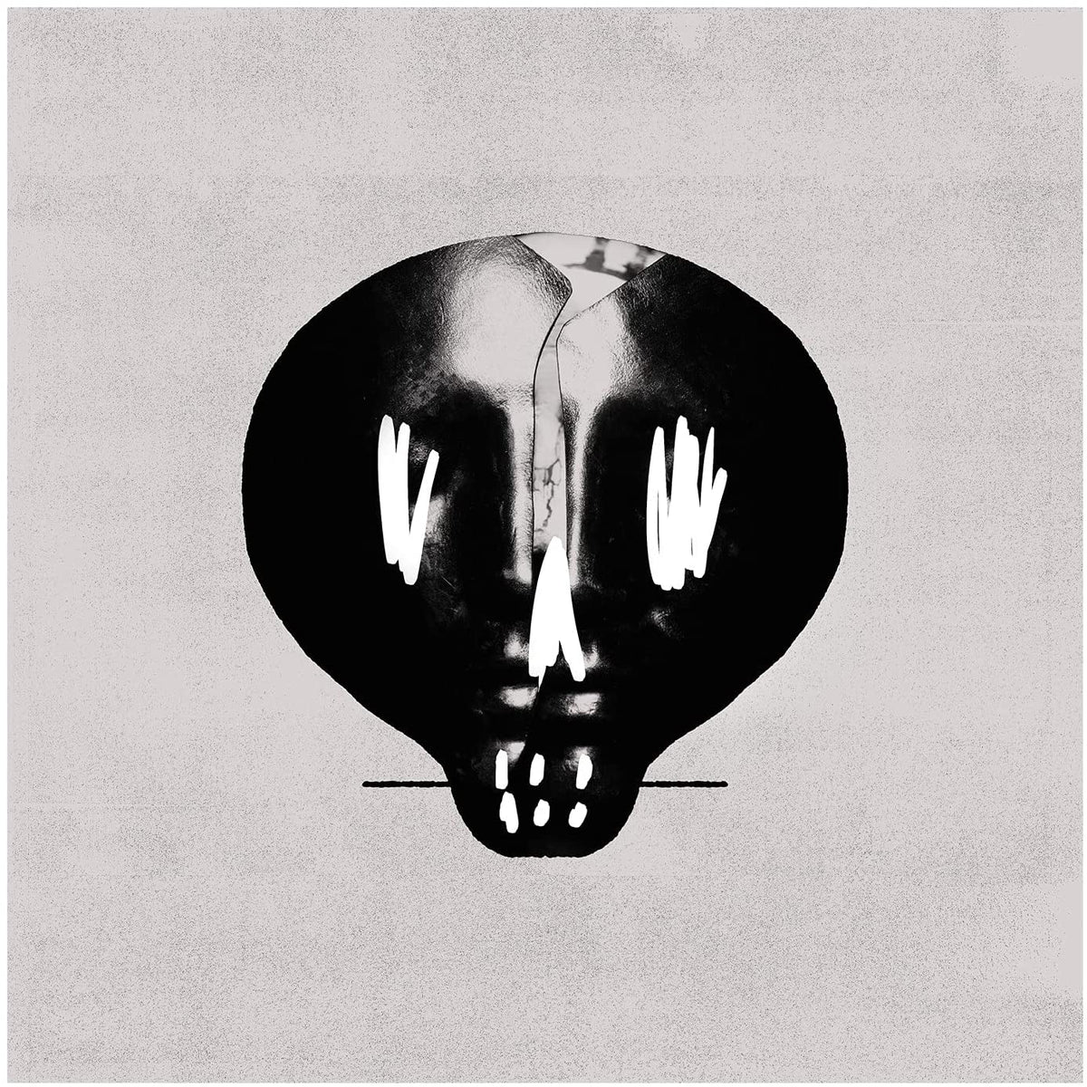 Black and white skull-shaped image on a textured gray background.