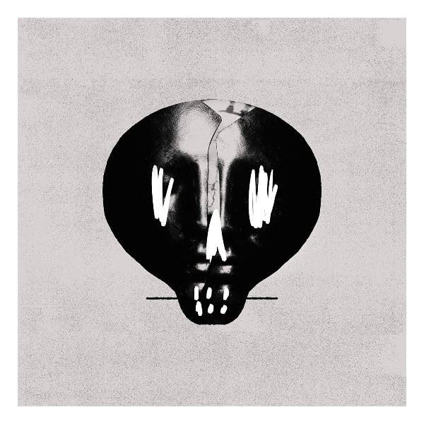 Black and white skull-shaped album cover with textured background.