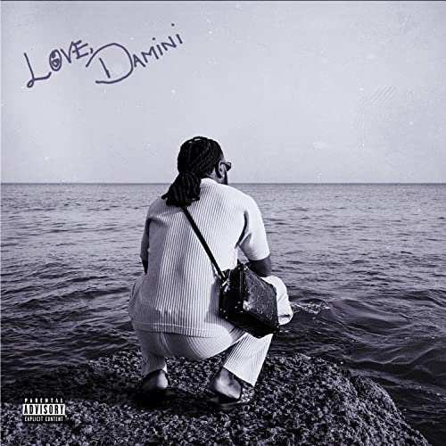 Burna Boy album cover: man facing ocean, muted blue tones.