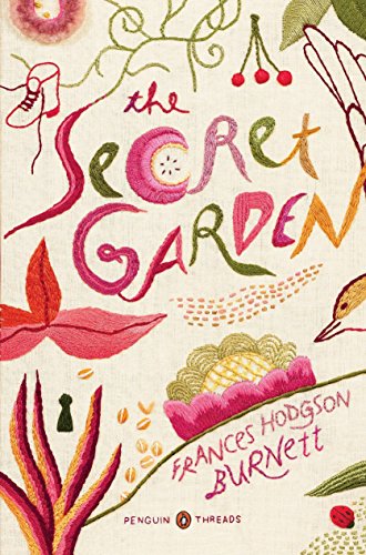 Book cover with embroidered title The Secret Garden and floral motifs on cream fabric.