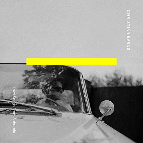 "Album cover with black and white car image and yellow rectangle, artist's name on right."