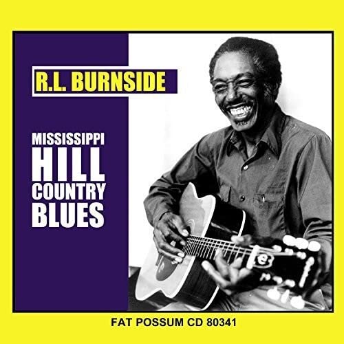 R.L. Burnside smiling, holding an acoustic guitar, album cover.