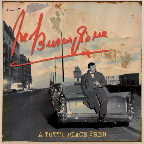 CD cover: man on car with city background, red text.