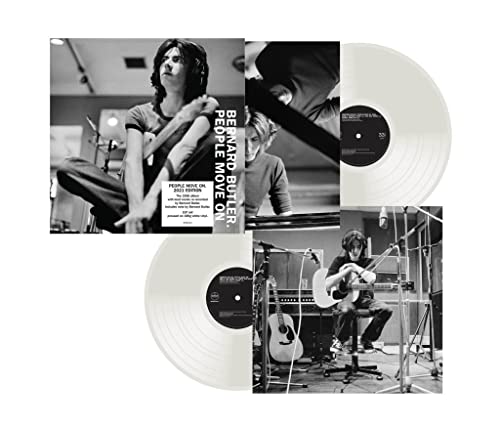 Black and white photos of Bernard Butler with vinyl records.