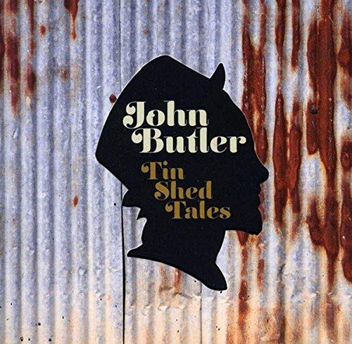 CD cover: black silhouette profile of a man on rusty metal.