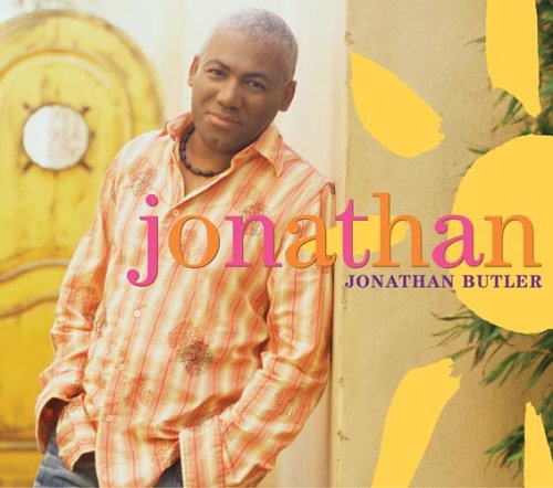 "Album cover featuring Jonathan Butler in an orange shirt, leaning against a wall."