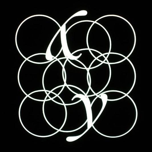 Black background with a white, abstract circular design resembling a letter.