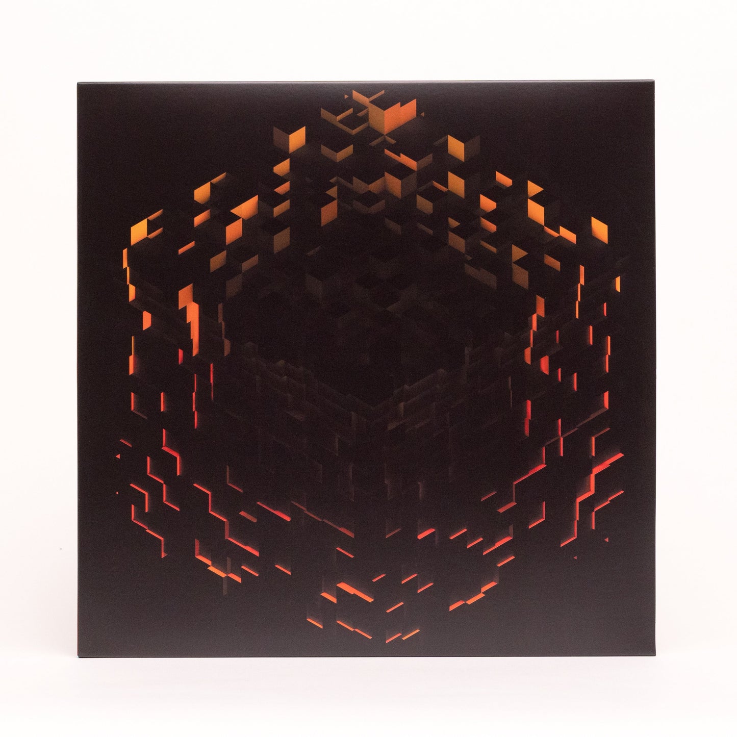 Black vinyl record cover with abstract, glowing orange Minecraft-style blocks.