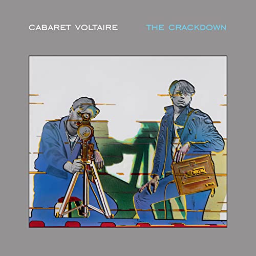 Album cover for Cabaret Voltaire The Crackdown showing two men with a film camera.