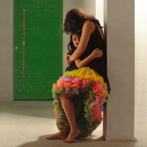 Camila Cabello album cover: two people embracing near a green door.