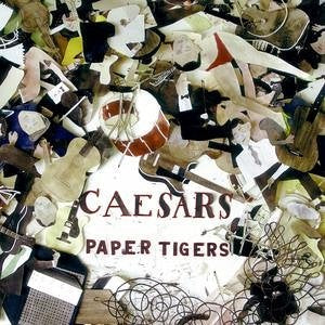 CD cover for Caesars’ “Paper Tigers” with collage of instruments and figures.