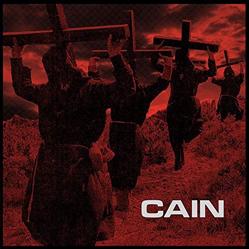Red album cover depicting figures with arms raised near crosses.