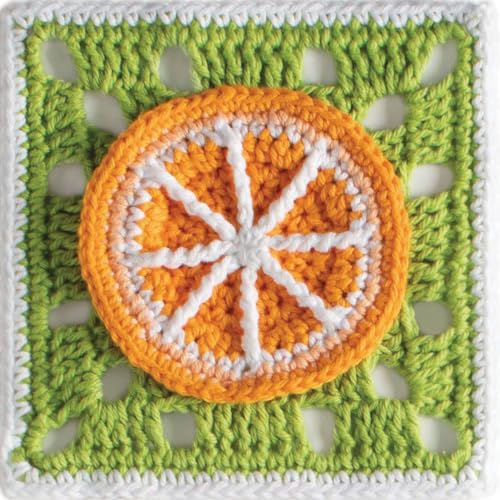 Crocheted orange slice on a green granny square background.