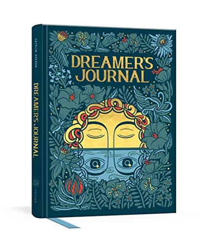Dark teal journal cover with floral design and a face illustration.
