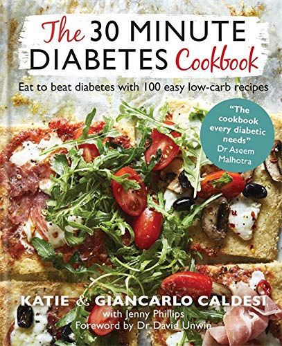Cookbook cover featuring a low-carb pizza with tomatoes and greens.