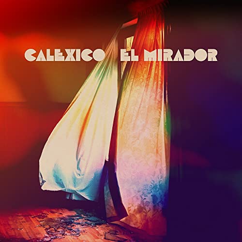 Calexico album cover: a figure obscured by flowing, colorful fabric.