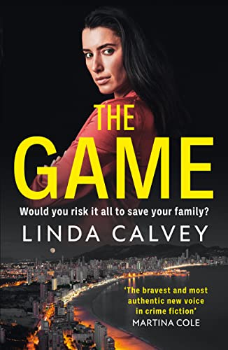 Book cover: woman’s face, bold yellow title “THE GAME”, city lights below.