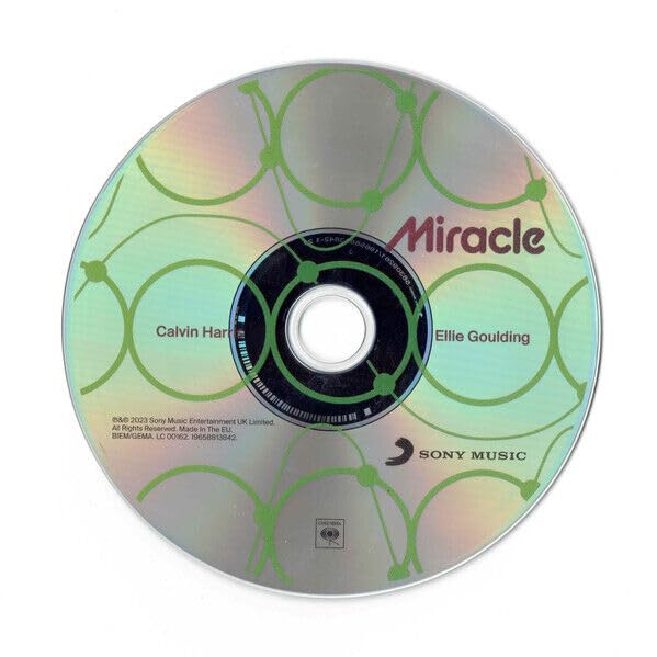 CD with iridescent green design, text “Miracle” by Calvin Harris & Ellie Goulding.