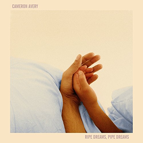 Vinyl album cover with clasped hands on a beige background, titled "Ripe Dreams, Pipe Dreams".