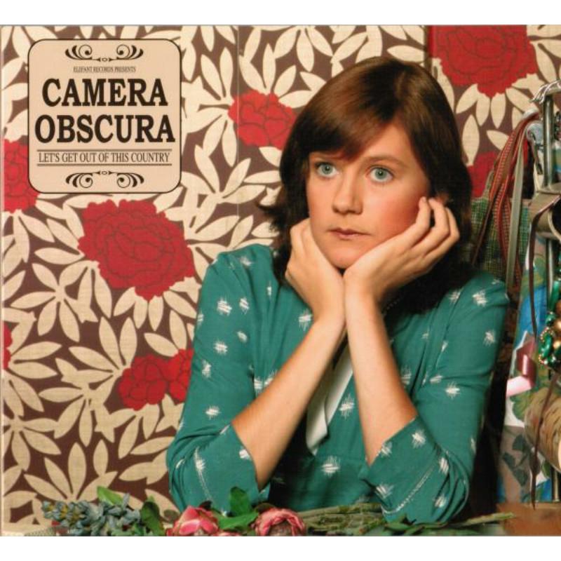 Album cover for Camera Obscura’s “Let’s Get Out Of This Country” featuring a woman.