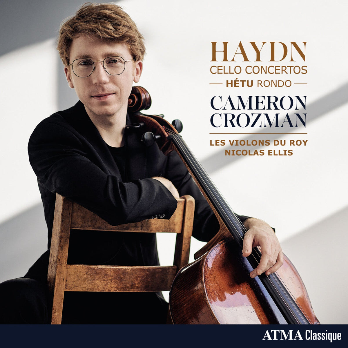 Cellist Cameron Crozman portrait with cello, album cover for Haydn concertos.
