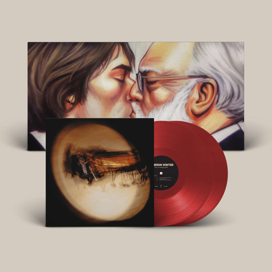 Red vinyl records with album cover depicting two men in a painted embrace.