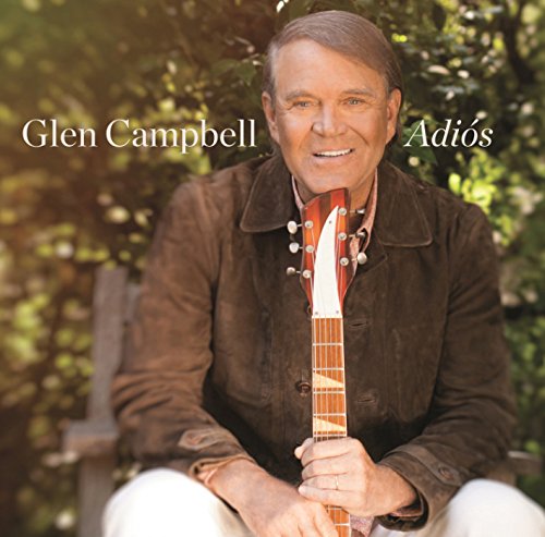 Glen Campbell album cover: man holding guitar, sitting outdoors with greenery in the background.