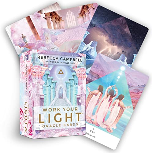 Work Your Light oracle card deck box and several cards with ethereal, dreamlike illustrations.
