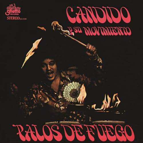 Album cover: man with flaming sticks, bold red text, dark background.