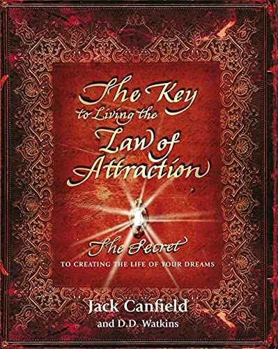 Book cover with red background, ornate gold border, and a glowing keyhole center.