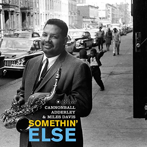 Cannonball Adderley with saxophone, album cover for “Somethin’ Else” by Miles Davis.