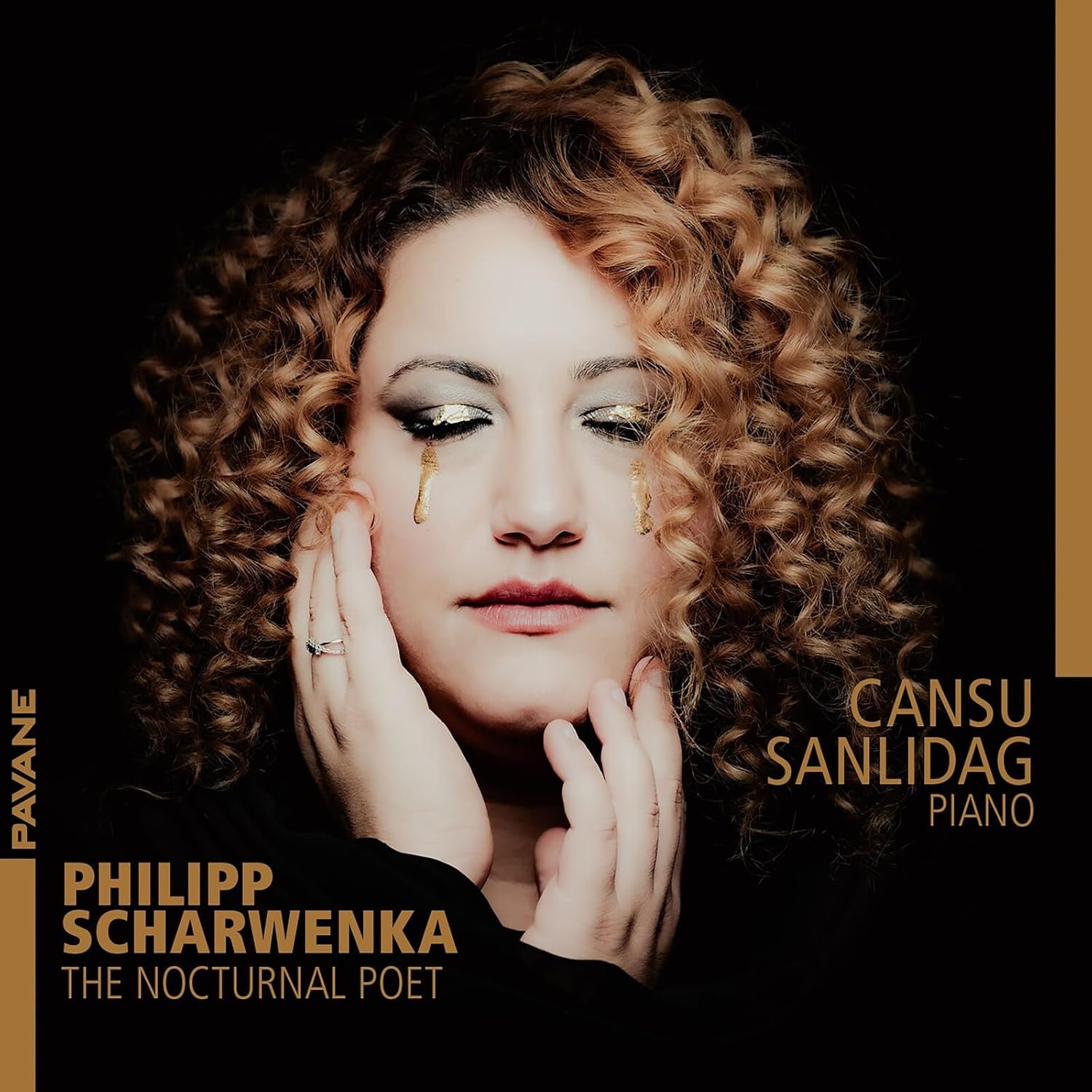 Close-up portrait of pianist Cansu Sanlidag with golden accents.