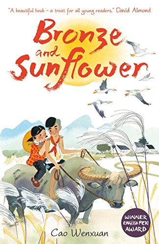Book cover: children riding an ox through a field, sunflowers, birds.