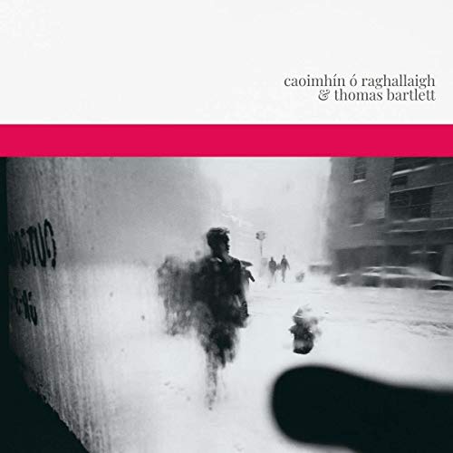 "Album cover with a black-and-white snowy street scene and red stripe."